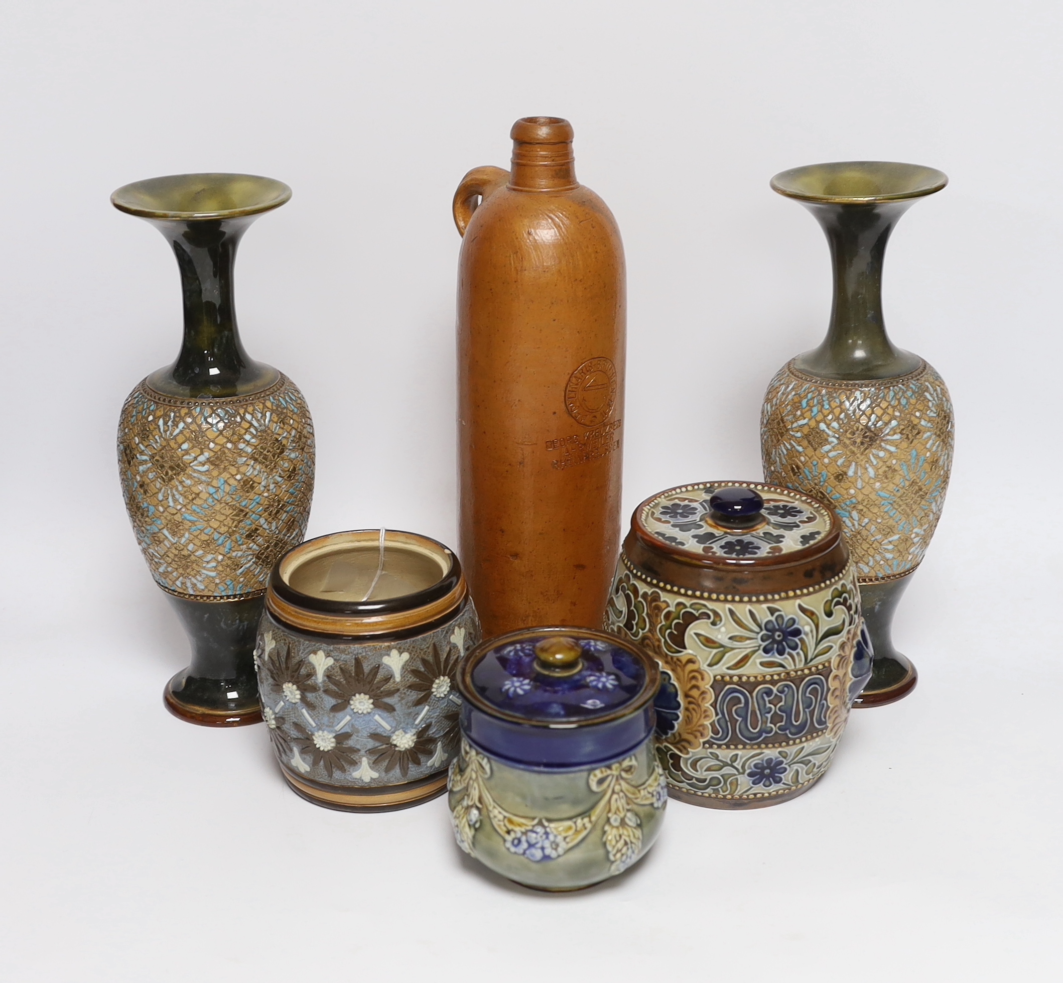 A pair of Doulton Lambeth vases, three jars, two with covers and a Georg Kreuzberg terracotta bottle